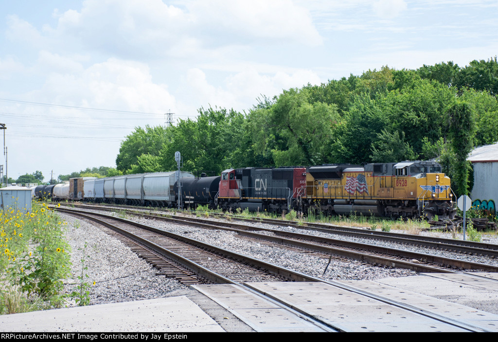 A UP train with a CN unit enters PTRA's North Yard